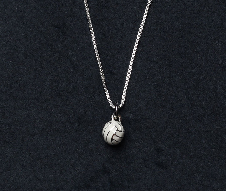 3D volleyball charm with silver and white enamel detail on sterling silver necklace